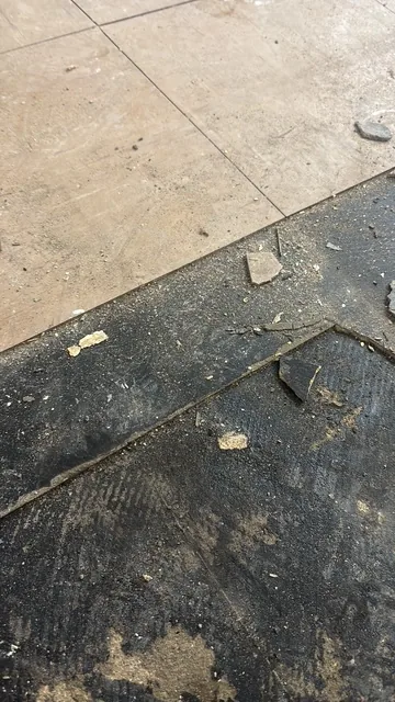 Black bitumen mastic floor removal in a SE23 flat
